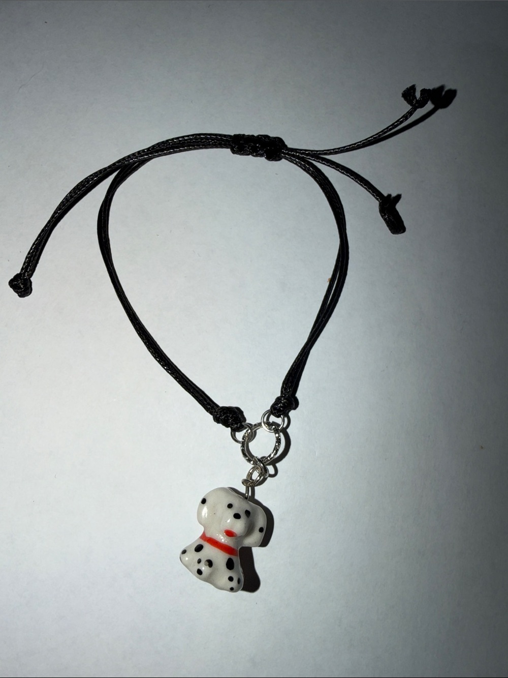 Adjustable Black Cord Bracelet with White Dalmatian Puppy Charm
